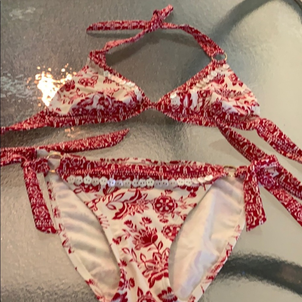 Two-piece swimsuit . Has shell beads